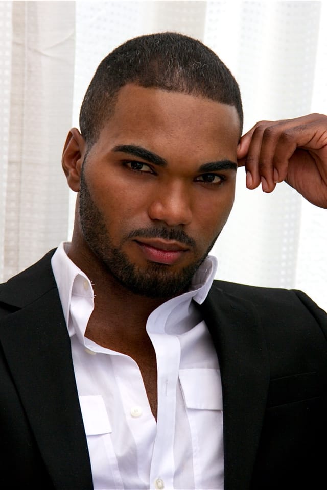 Luis Olivares headshot in a suit